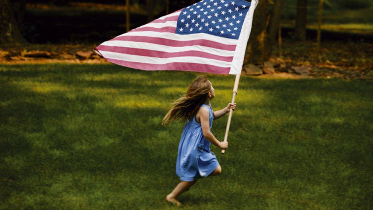 Girl running with flag